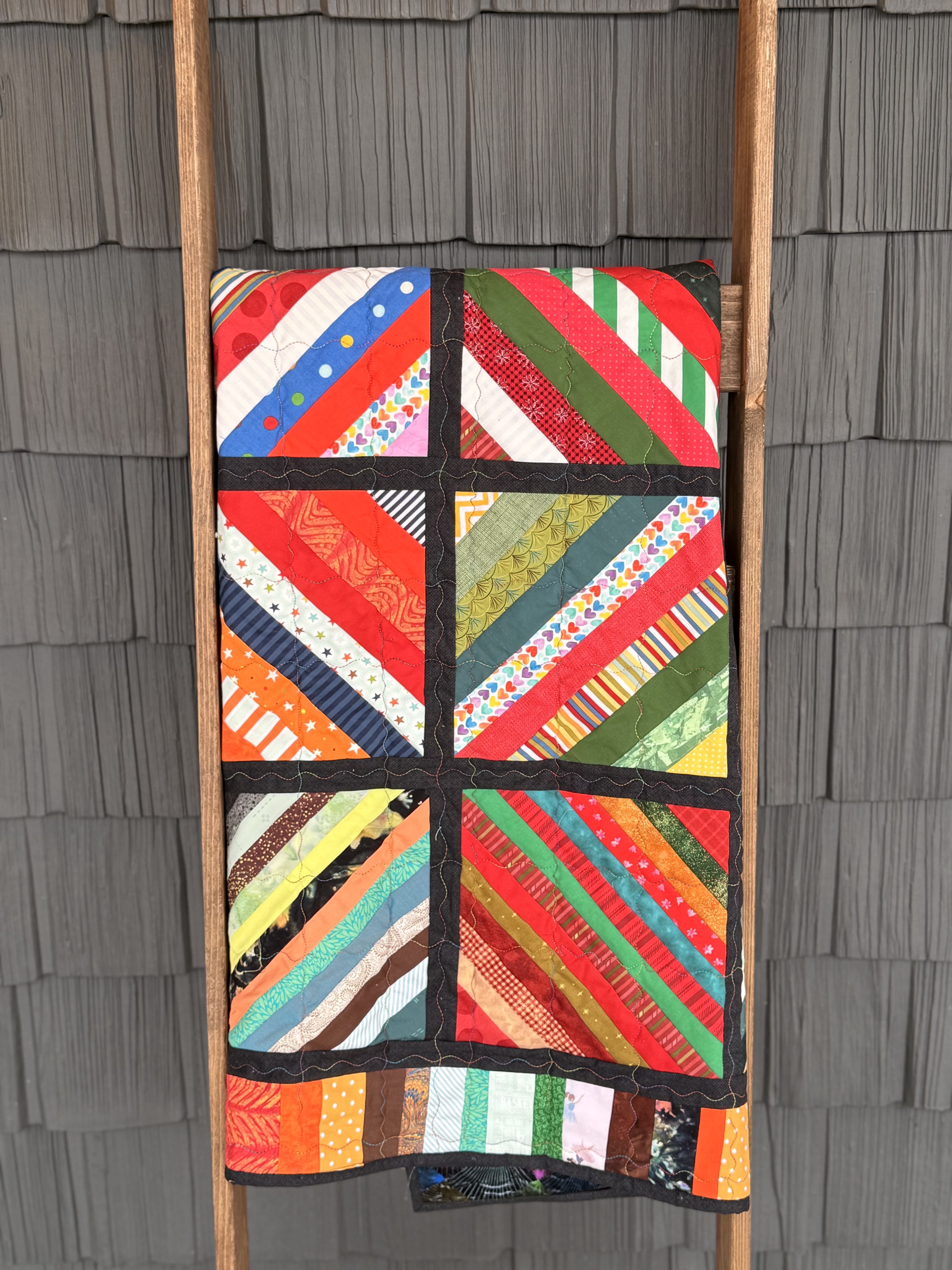 Vibrant Rainbow Strip Quilt